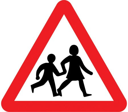 A white triangle with a red border and two children walking