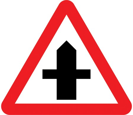 A white triangle with a red border and a black cross