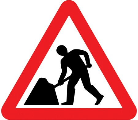 A white triangle with a red border and a person digging